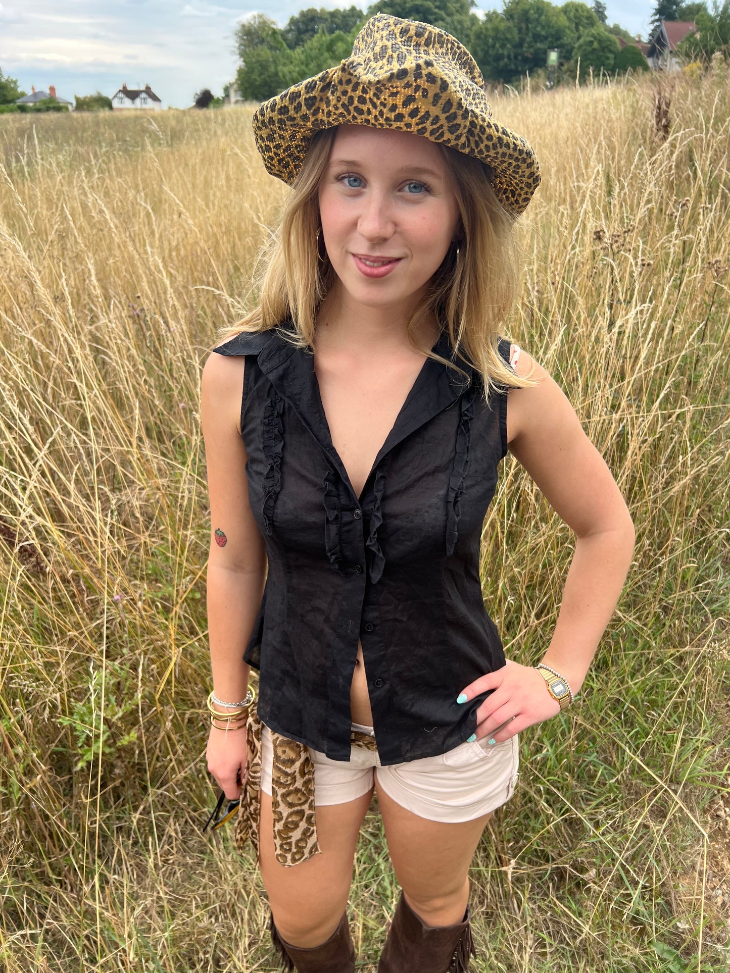 Black sleeveless ruffle blouse