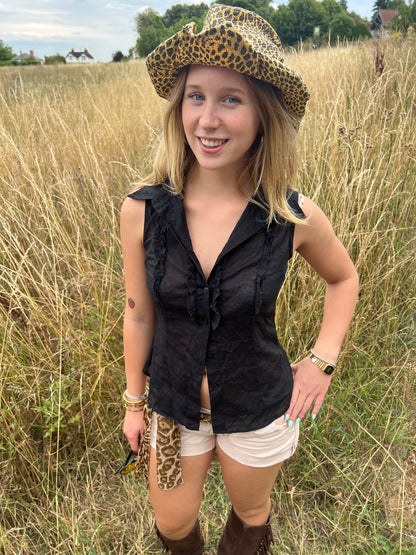 Black sleeveless ruffle blouse