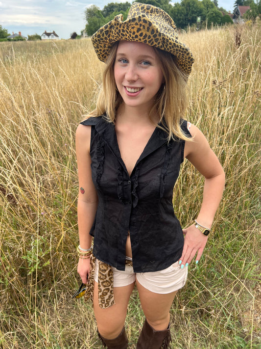 Black sleeveless ruffle blouse