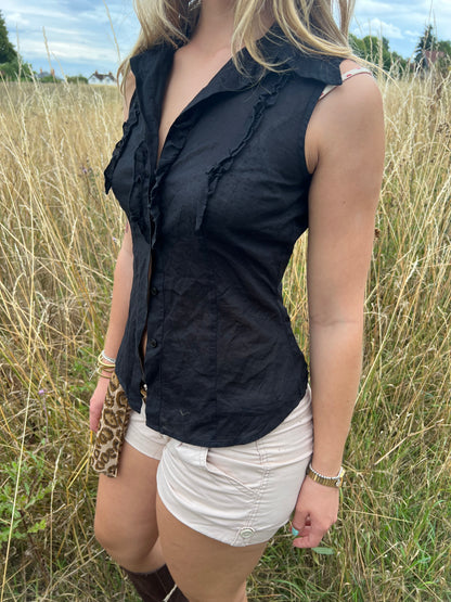 Black sleeveless ruffle blouse
