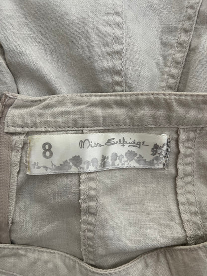 Label on a piece of clothing with 'Miss Selfridge' branding